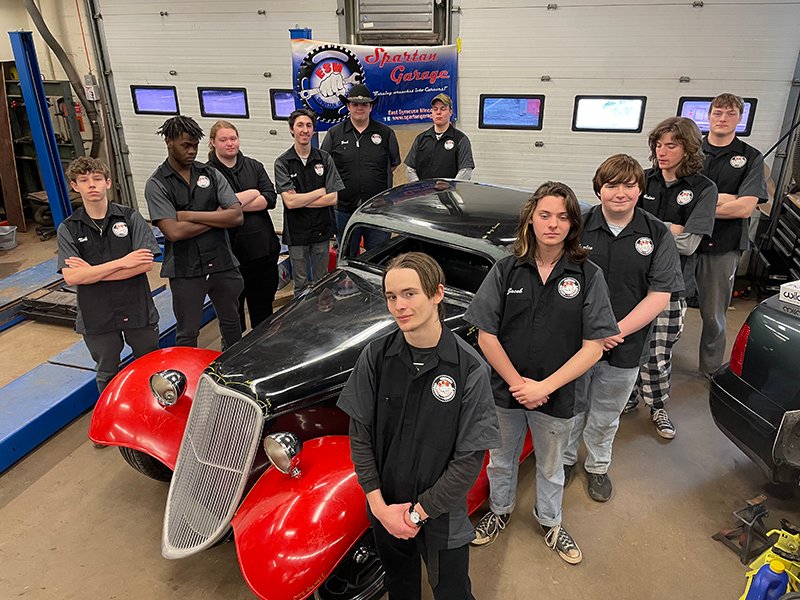 Class of 2023 students standing with the 1933 Factory Five Hot Rod